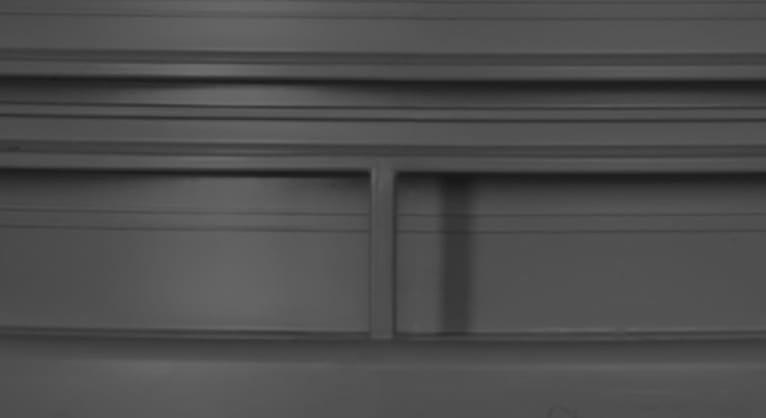 A close-up dark grey abstract pattern